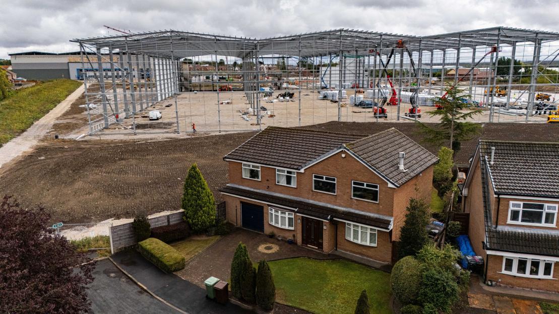 'It's like a cruise ship in our garden': New 60ft warehouses loom over homes