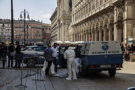 Forensic investigators at a crime scene in Milan.