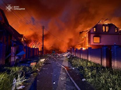 Firefighters battling a fire at burning houses in the Kyiv region.