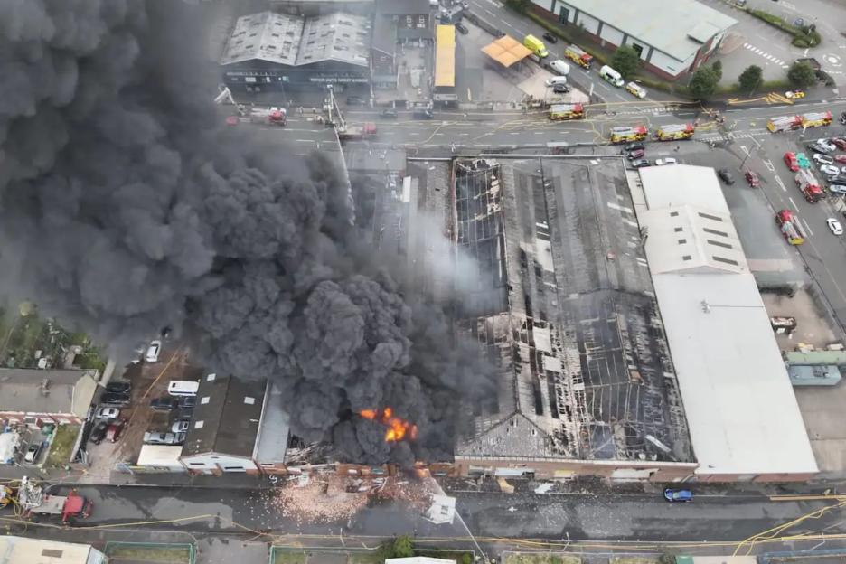 Huge blaze breaks out at factory with 100 firefighters raced to scene & thick plumes of smoke billowing through sky