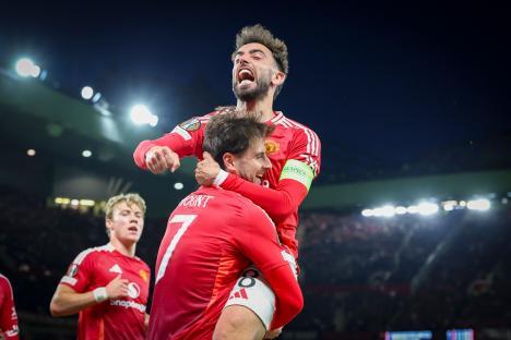 Manchester United players Mason Mount and Bruno Fernandes celebrating a goal.
