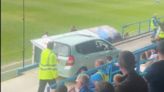 Moment car ends up pitch side in middle of English football match as fans say ‘non-league at its finest’