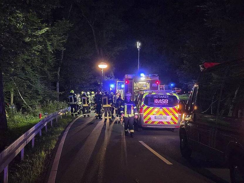 Emergency responders at a fatal car crash scene.