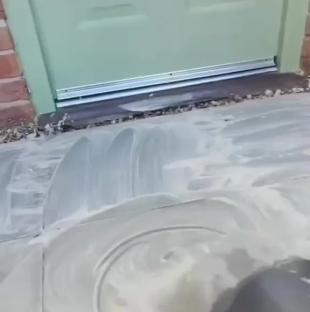 Patio being cleaned with a cleaning product.