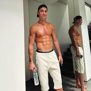 Cristiano Ronaldo holding a water bottle.