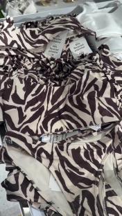 Zebra-print bikini top and bottom made from recycled polyester.