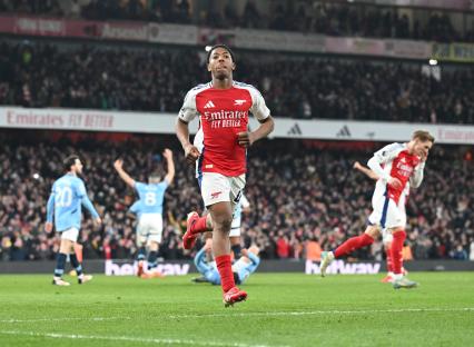Myles Lewis-Skelly celebrating an Arsenal goal.