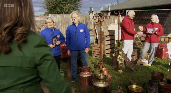 Bargain Hunt presenters at an outdoor antiques fair.