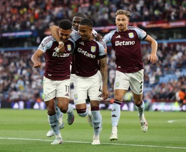Aston Villa players celebrating a goal.