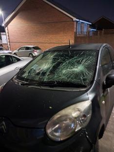 Car windshield smashed in gang attack.