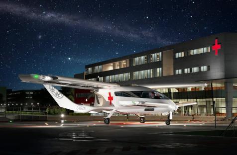 Illustration of the Cavorite X7 eVTOL aircraft at night, parked outside a hospital.
