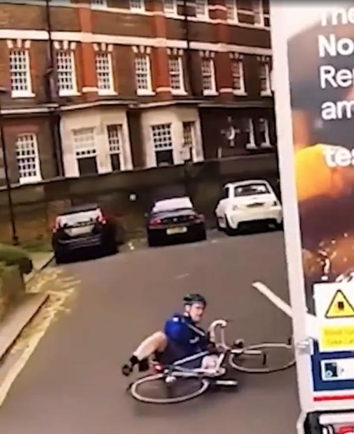 A cyclist falling off their bike after being hit by a Tesco delivery van.