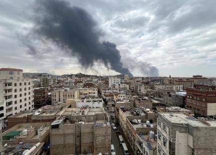 Smoke billows over Sana'a, Yemen, following an Israeli airstrike on Houthi infrastructure.