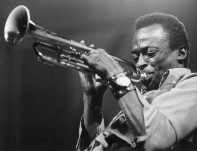 Miles Davis playing trumpet.