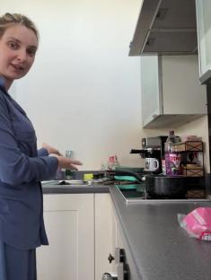 Woman in a kitchen giving an update.
