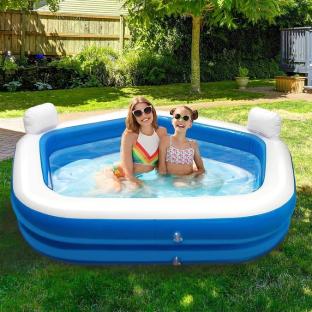 Two girls in a blue inflatable pool.