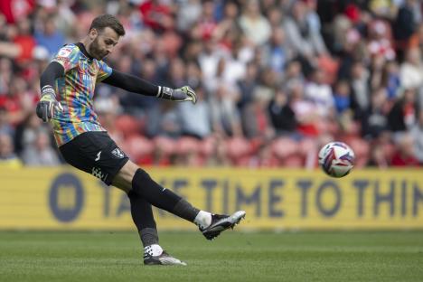 Angus Gunn, Norwich City goalkeeper, kicks the ball during a soccer match.
