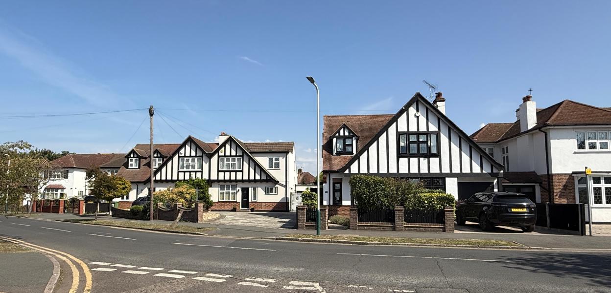 Tudor-style houses on a residential street.