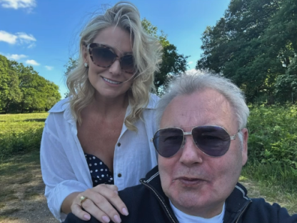 Photo of a man and woman outdoors.