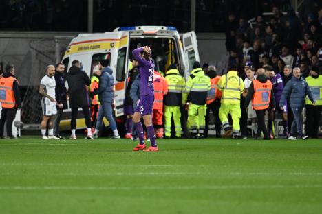 Soccer player being taken to hospital after collapsing on the field.