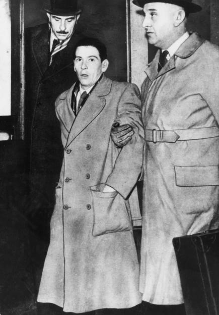 Timothy Evans, under police guard, during the Christie murder case.