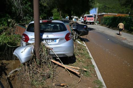 This photograph shows a damaged car on a mud-covered street following a flood caused by heavy rain in Cavaliere village of Le Lavandou commune in the Var department, southeastern France, on May 20, 2025. Intense rainstorms in the southeastern Var department have left at least three people dead, including an octogenarian couple in Le Lavandou, on the coast, authorities reported. (Photo by Christophe Simon / AFP) (Photo by CHRISTOPHE SIMON/AFP via Getty Images)