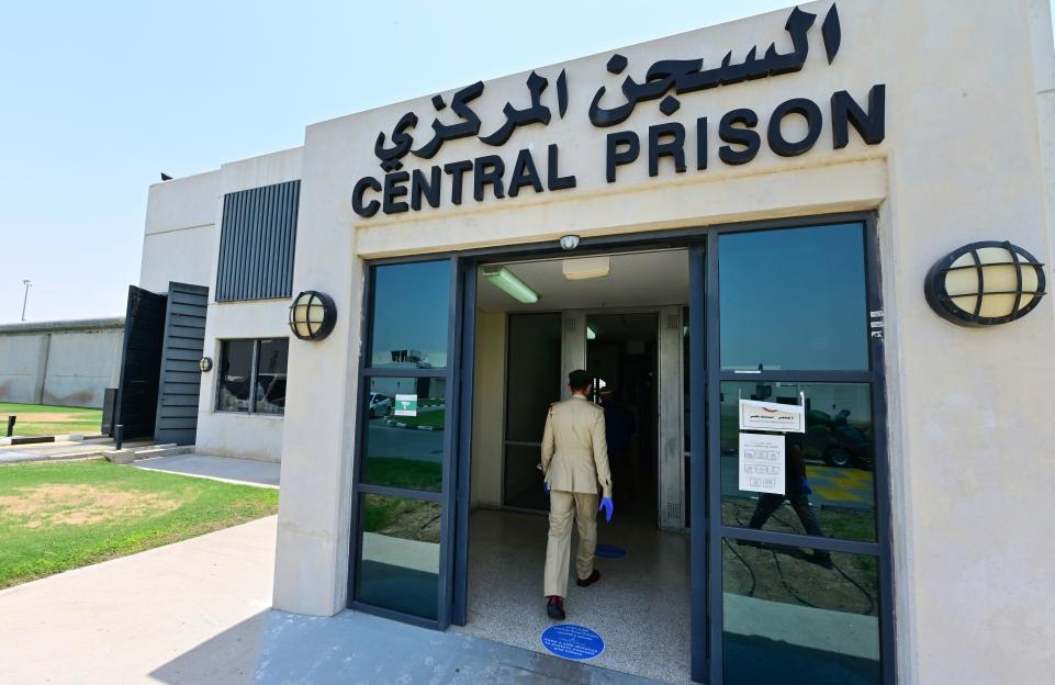 A police officer enters Dubai's Al-Awir Central Prison.