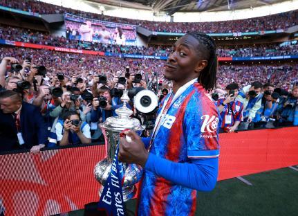 Eberechi Eze of Crystal Palace celebrates with the FA Cup trophy.