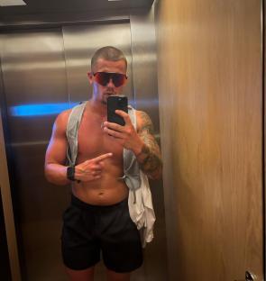Man taking a selfie in an elevator.