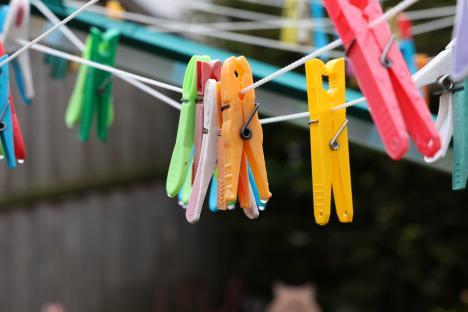 Colorful clothespins on a clothesline.