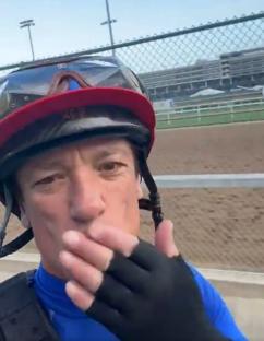 Frankie blowing a kiss at the racetrack.