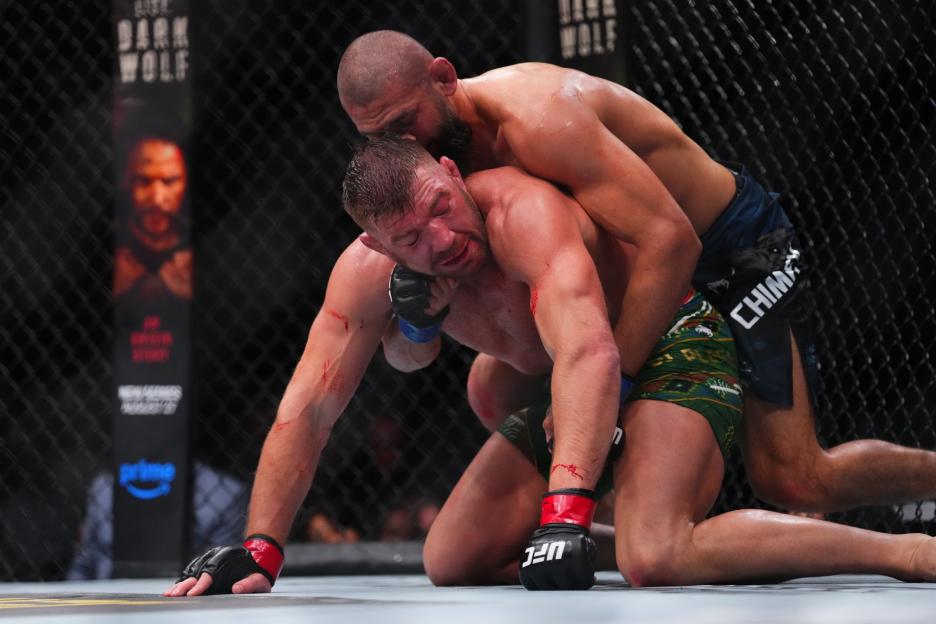 CHICAGO, ILLINOIS - AUGUST 16: Khamzat Chimaev of Russia controls Dricus Du Plessis of South Africa on the mat in the UFC middleweight championship fight during the UFC 319 event at the United Center on August 16, 2025 in Chicago, Illinois. (Photo by Cooper Neill/Zuffa LLC)