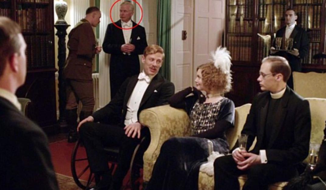 Hugh Norton in a cameo role, wearing a tuxedo.