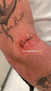 Close-up photo of a new tattoo that says