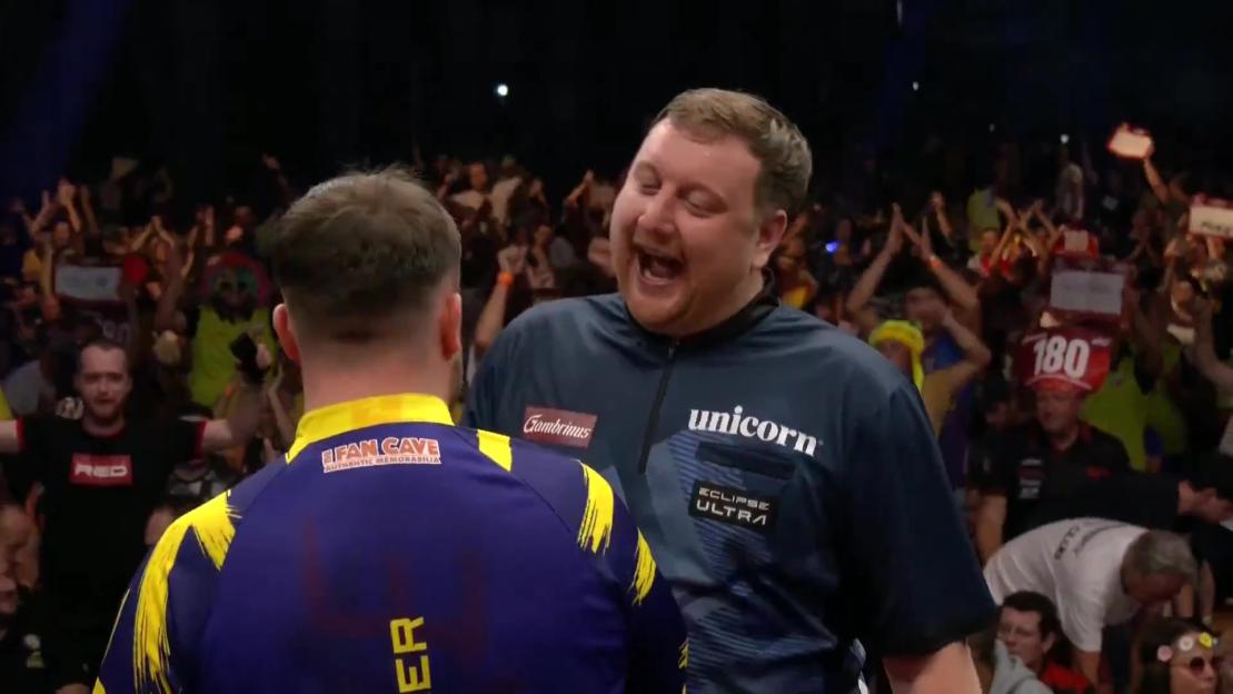 Luke Littler celebrates a darts victory.