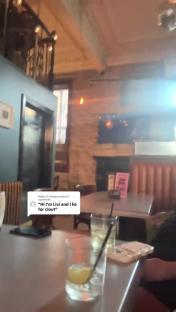 Interior of a bar or restaurant with drinks on a table.