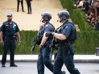 Illustration of Met Gala security plan showing a mile-wide frozen zone around the museum with drones, snipers, and bomb-sniffing dogs.