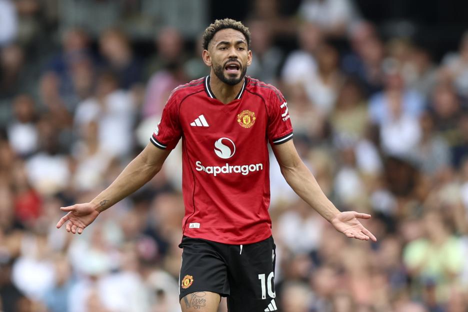 Matheus Cunha of Manchester United reacting during a soccer match.