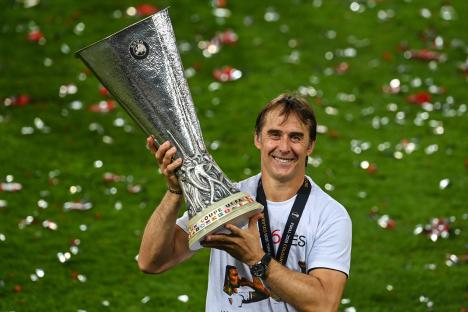 Julen Lopetegui holding the UEFA Europa League trophy.