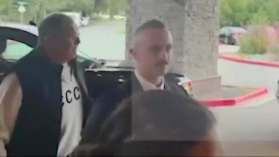 Sergei Lavrov at a summit wearing a CCCP sweatshirt.