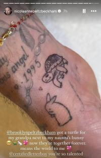 Close-up of a wrist tattoo depicting a turtle and a rabbit.