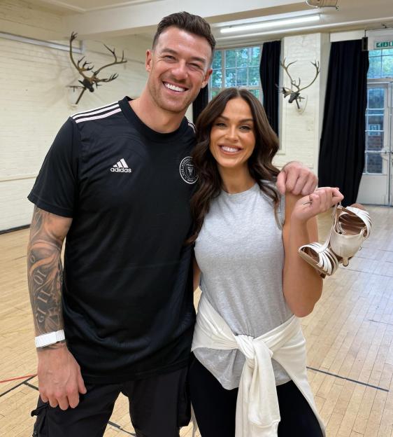 Vicky Pattison and her professional dance partner Kai Widdrington posing for a photo.