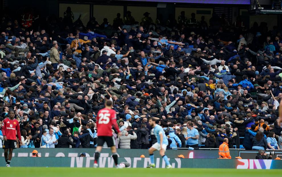 Manchester City fans doing the Poznan at a Premier League match.