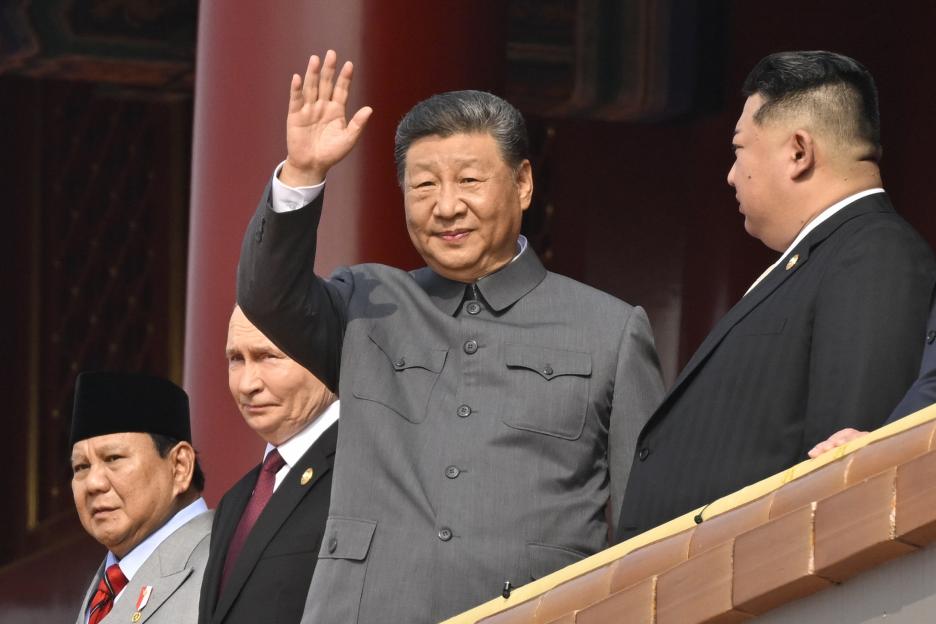 Chinese President Xi Jinping waving from Tiananmen Gate, with Indonesian President Prabowo Subianto, Russian President Vladimir Putin, and North Korean leader Kim Jong Un beside him.
