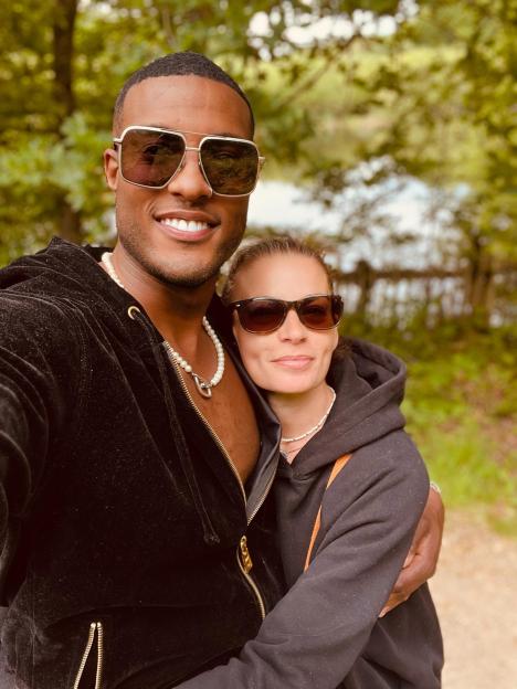 Couple embracing outdoors.