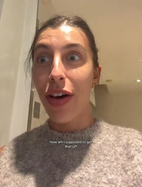 A woman with wide eyes and an open mouth expresses frustration as text overlays read, "My delivery driver has locked me in my own house" and "how am I supposed to get that off".