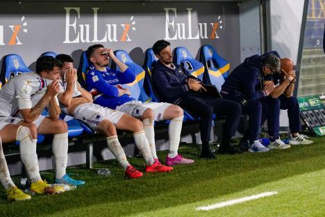 Dejected UC Sampdoria players and coaches on the bench after a Serie B match.