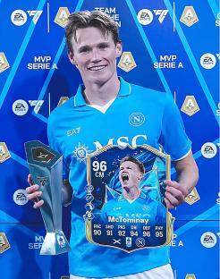 Scott McTominay holding Serie A MVP and Man of the Match awards.