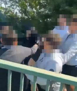 Police making arrests following a school assault.