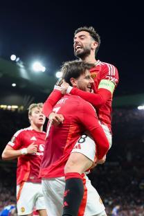 Manchester United players Mason Mount and Bruno Fernandes celebrating a goal.